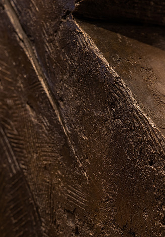 close up image of sheeny, rustic, metallic textures in browns and golds in warm huesjpg