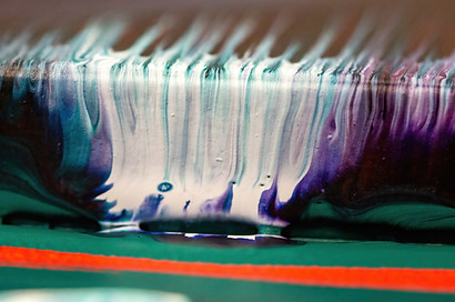 blended and melted paints of blues, whites and purples contrast to greens and reds up close and texture to represent the 'Custom Art Collections' of artelier's services