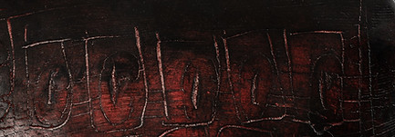 red reiku ceramic artwork, showing cracks with light filtering through.