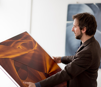 picture of christoph schrein looking at his canvas artwork