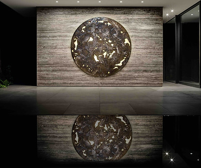 a tom palmer commission managed by artelier for a residential house, featuing a large circular piece with golds and browns
