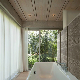 Wooden feature wall for bathroom, showing three wooden panels in a geometric wood art design.