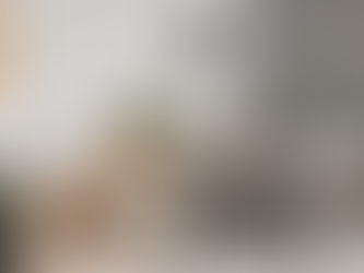 Wooden art feature wall using bespoke carved wood mosaics to create a grey wall art piece.