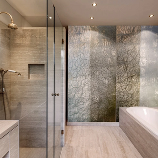 An interior bathroom using verre eglomise which uses artisan french technique to create stunning gold leaf wall art.
