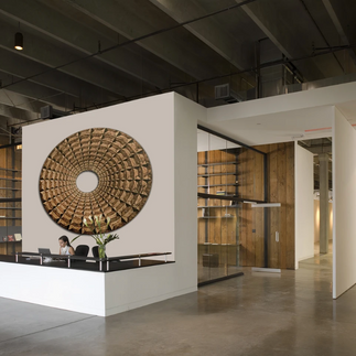 A three dimensional wood art sculpture arranged in a hypnotic circular like form for a hotel project.
