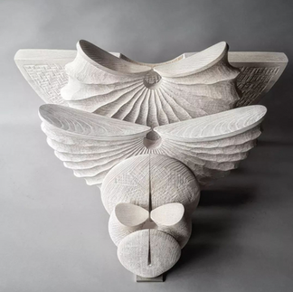 Contemporary wood art sculpture in plaster white, of various forms, shapes and sizes.