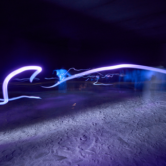 Ayman Yossri Daydban’s White Noise (2016) is an interactive sensory art installation that invites the viewer to explore their inner world through the act of walking on salt. Designed to enhance self-awareness, the artwork is part of Daydban’s The State series, which encourages the audience to discover a ‘state’ within each space.  Visitors enter a darkened room where the floor is covered with nearly two tons of natural salt. The darkness, sounds and textures of the space evoke a time before the cacophony of modern life, when humans were more connected to nature and raw materials. A neon sign beams on the other end, bathing the surrounding space in a soft glow. The sign asks: “When was the last time you heard the crunch of your shoes walking on salt?”  Reflecting on these words, visitors are encouraged to tread on the grains, either barefoot or with their shoes on, and contemplate how they interact with their surroundings.