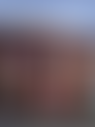 A continuation of previous vibrant murals in pink, white, black by experienced public artist Ian Kirkpatrick on the exterior of a building, painted where windows would otherwise presumably be.