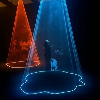 Nick Verstand’s AURA (2017) is an audiovisual installation that transforms people’s emotions into undulating light compositions. Developed in collaboration with Dutch sound artist Salvador Breed (b. 1984), the project is a visual tribute to British artist Anthony McCall’s series Solid Light Works, which features volumetric shapes composed of projected light in a three-dimensional space.  In Verstand’s AURA, three conical beams hang like translucent curtains from the ceiling of a dark room. When the installation debuted at Dutch Design Week in 2017, visitors were invited to sit or lie within the perimeter of these compositions while equipped with biosensors that tracked heart rate, galvanic skin response and brainwaves. As they listened to Breed’s musical piece, their individual ‘emotional’ data was reflected in the light’s form, color, and intensity.  At Noor Riyadh 2024, the artwork’s light compositions are based on data from past visitors, allowing the new audience to sit within the beams and experience the emotional responses of those who interacted with the artwork before them.