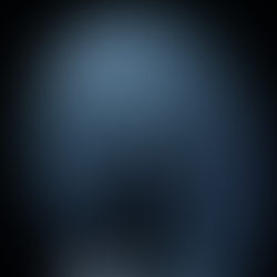 A.A.Murakami’s The Passage of Ra (2024) is a multimedia art installation inspired by Ra, the sun deity in ancient Egyptian mythology, and his daily passage across the sky to create day and night.  The artwork features a screen projection of a digital seascape and tangible fog rings that float toward it. Upon contact with the wall, the rings vanish into the air and appear on screen to sail into the ocean horizon, resuming their journey in a virtual world. Ra’s never-ending voyage is reflected in the fog rings, which transcend our physical space to achieve eternity in the digital realm.  In this liminal space between art and technology, the viewer is invited to draw parallels between the short-lived fog rings and the fleeting nature of our existence, both destined to break down and transform into new states of energy across dimensions.