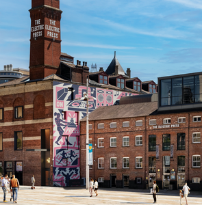 Examples of Ian Kirkpatrick's mural artworks, showing flamboyant bright colours on largle scale sides of buildings in urban settings, mainly in london