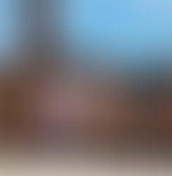 Examples of Ian Kirkpatrick's mural artworks, showing flamboyant bright colours on largle scale sides of buildings in urban settings, mainly in london