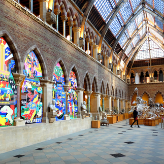 A unique public artwork commissioned for Manchester, using bright mural art set in alcoves in a church interior, commissioned and curated by artelier public art consultancy.