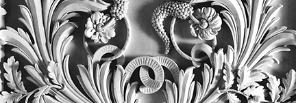 plaster bas relief artwork showcasing natural flora and fauna.